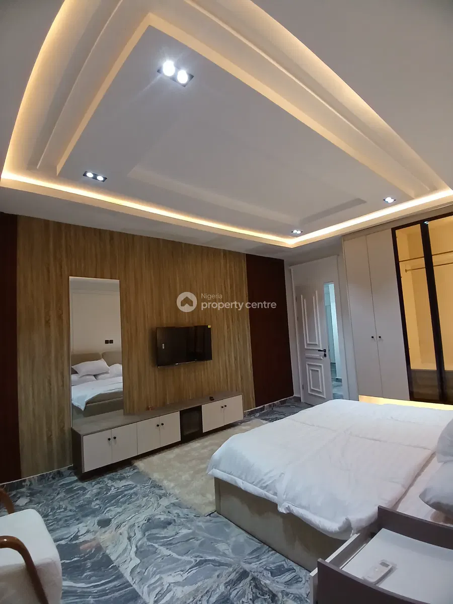 Bedroom view showing television wall and wardrobe
