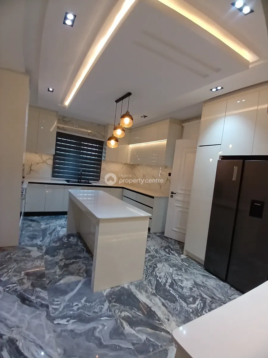 Fitted kitchen with island, cabinetry and appliances